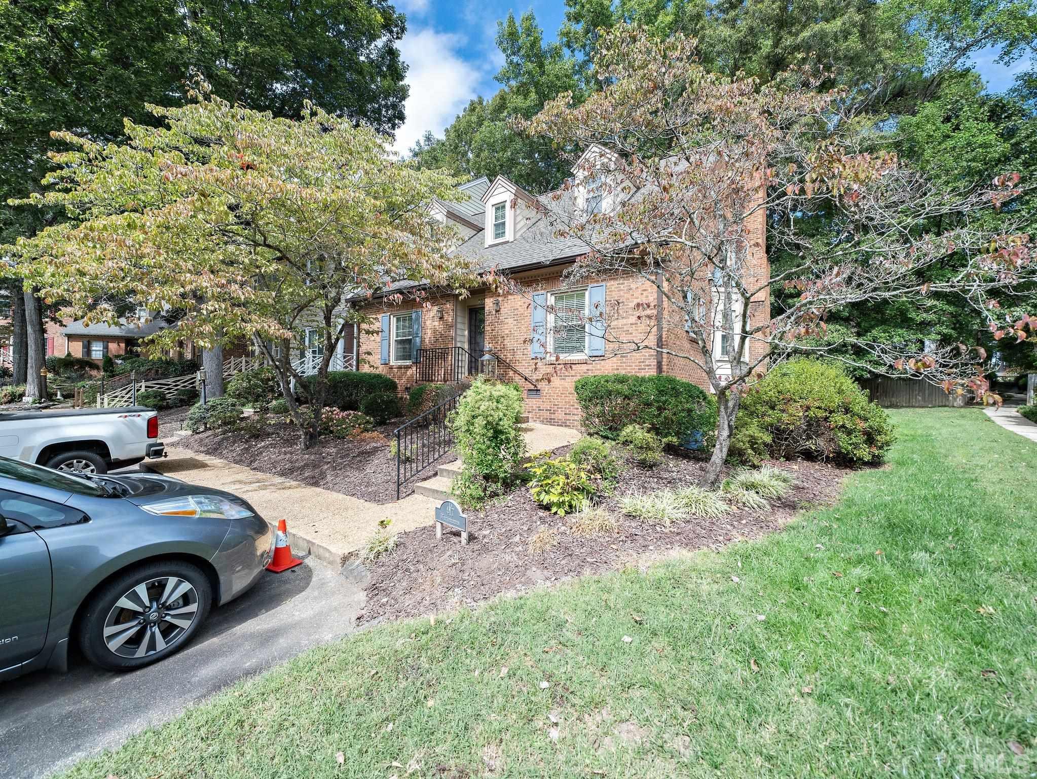 417 Weathergreen Drive Raleigh, NC 27615 - Photo 4 of 37 a front view of a house with a garden