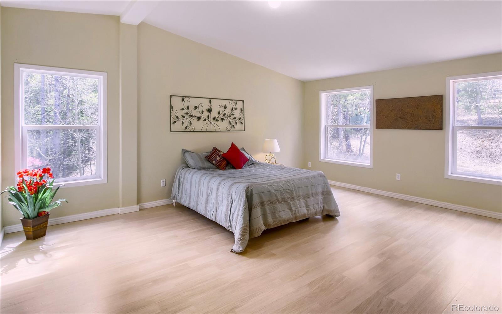 120 Blue Spruce Road Black Hawk, CO 80422 - Photo 13 of 27 a bedroom with a bed and a window