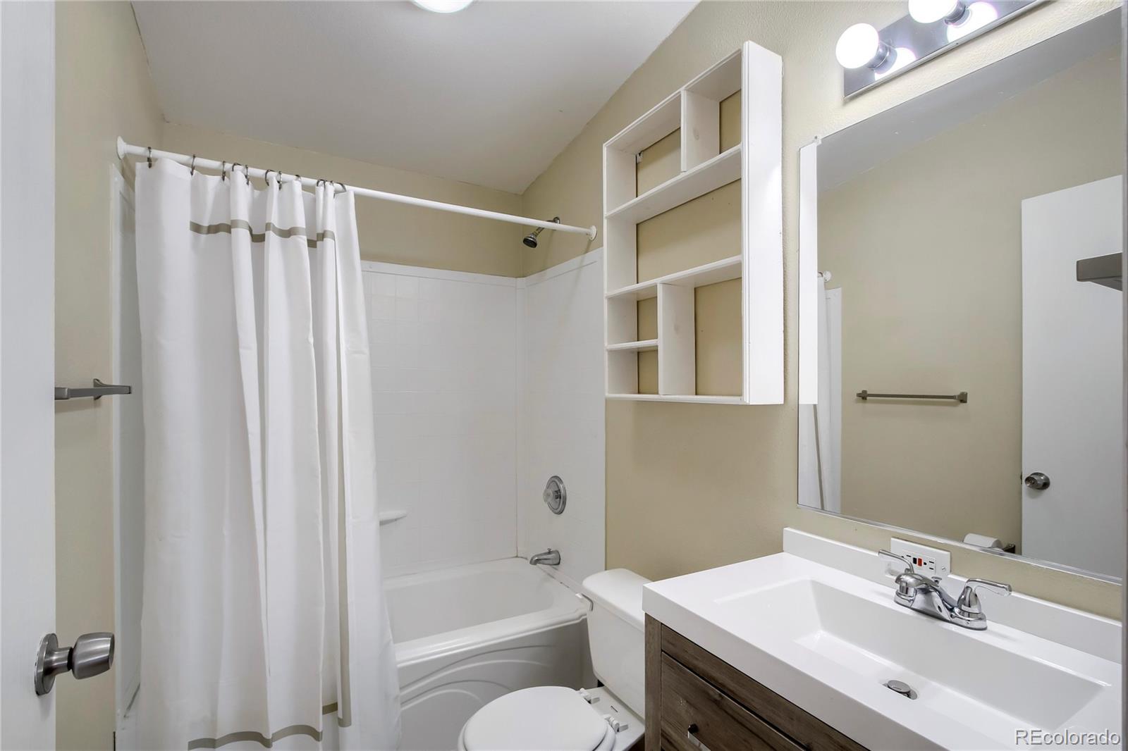 120 Blue Spruce Road Black Hawk, CO 80422 - Photo 21 of 27 a bathroom with a sink a toilet and shower