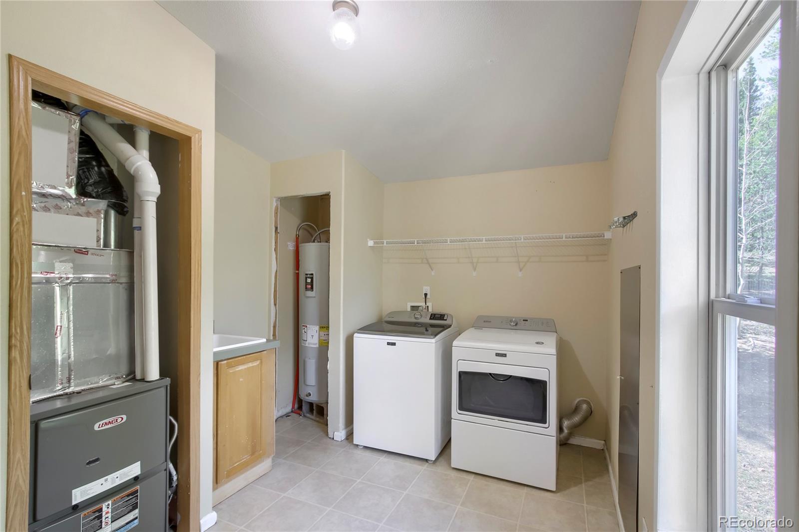 120 Blue Spruce Road Black Hawk, CO 80422 - Photo 22 of 27 a utility room with dryer and washer