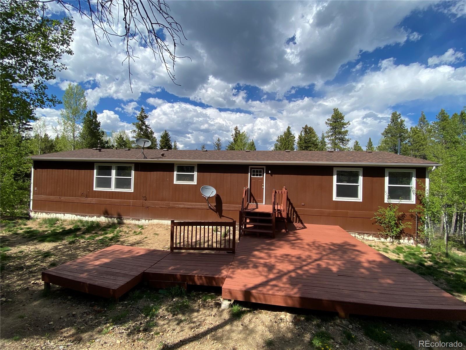 120 Blue Spruce Road Black Hawk, CO 80422 - Photo 27 of 27 front view of a house with a yard