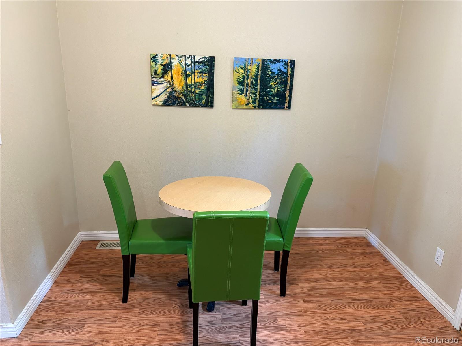 120 Blue Spruce Road Black Hawk, CO 80422 - Photo 7 of 27 a view of a dining room with furniture and wooden floor