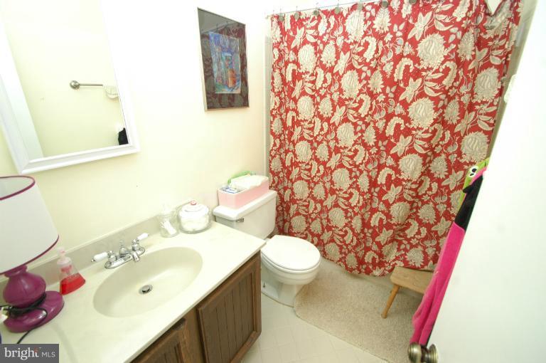 4331 Cub Run Road Chantilly, VA 20151 - Photo 13 of 30 a bathroom with a sink and a mirror
