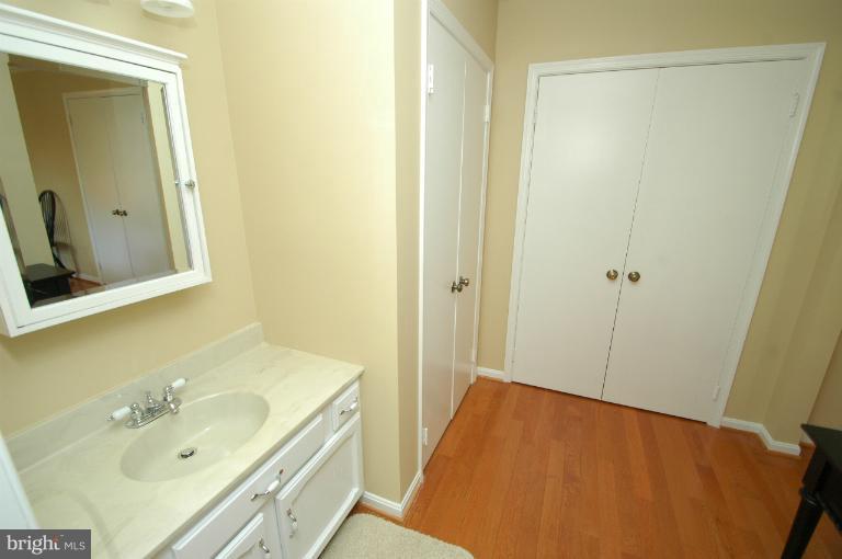 4331 Cub Run Road Chantilly, VA 20151 - Photo 14 of 30 a bathroom with a sink a mirror and a shower