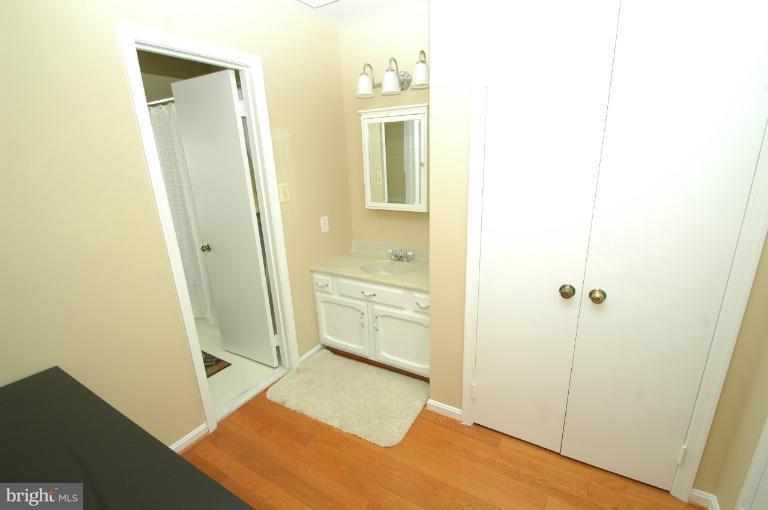 4331 Cub Run Road Chantilly, VA 20151 - Photo 23 of 30 a bathroom with a tub sink and a mirror