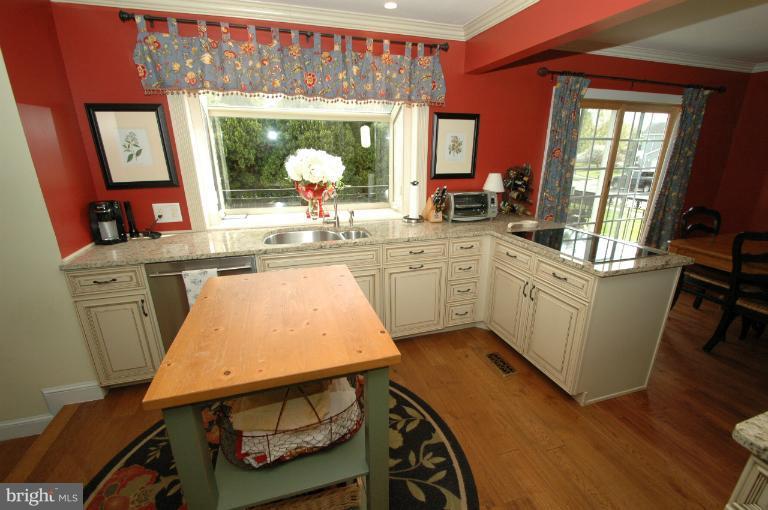 4331 Cub Run Road Chantilly, VA 20151 - Photo 28 of 30 a kitchen with a table chairs sink and cabinets