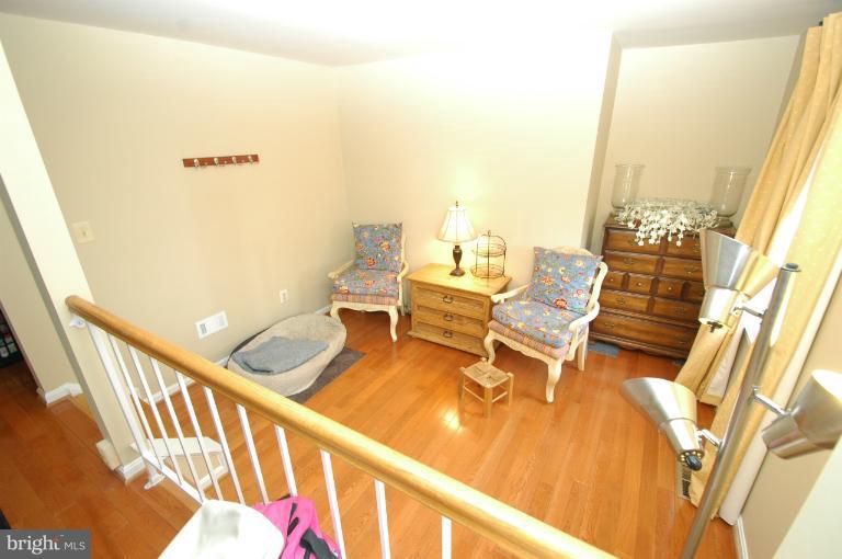 4331 Cub Run Road Chantilly, VA 20151 - Photo 4 of 30 a living room with dining room and wooden floor