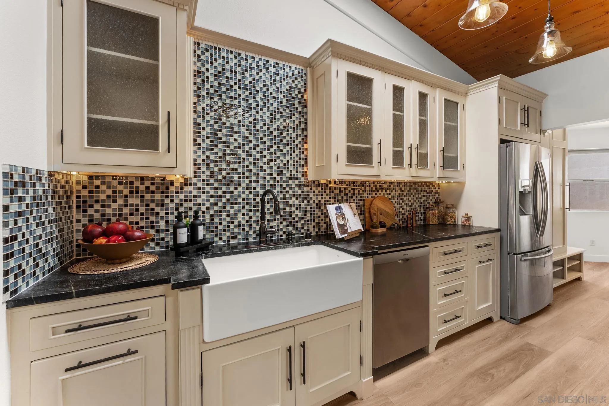 12832 Stone Canyon Road Poway, CA 92064 - Photo 9 of 60 a kitchen with stainless steel appliances a stove and a refrigerator