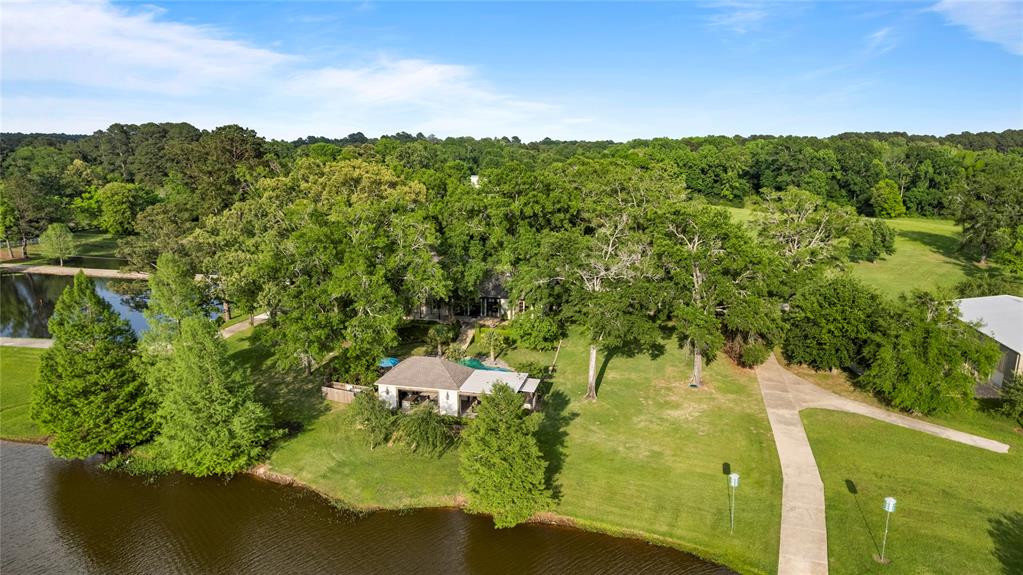 3920 Smelley Road Longview, TX 75605 - Photo 32 of 35 a view of a lake from a yard