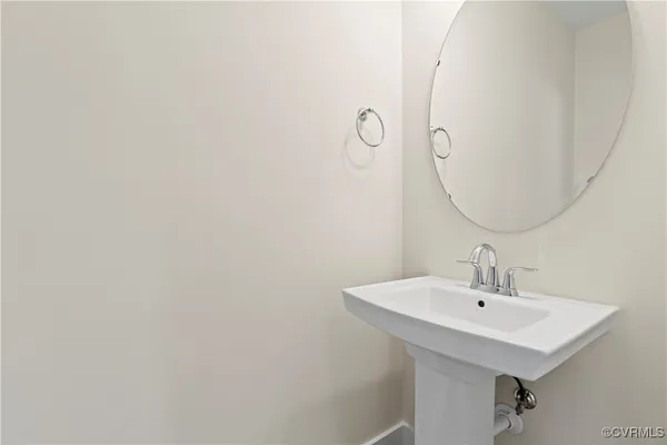 a bathroom with a sink and mirror