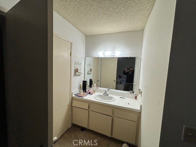 33371 Cheltam Way, Unit 3 Dana Point, CA 92629 - Photo 22 of 24 a bathroom with a sink and a mirror