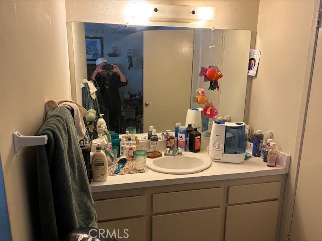 33371 Cheltam Way, Unit 3 Dana Point, CA 92629 - Photo 24 of 24 a bathroom with a sink and mirror