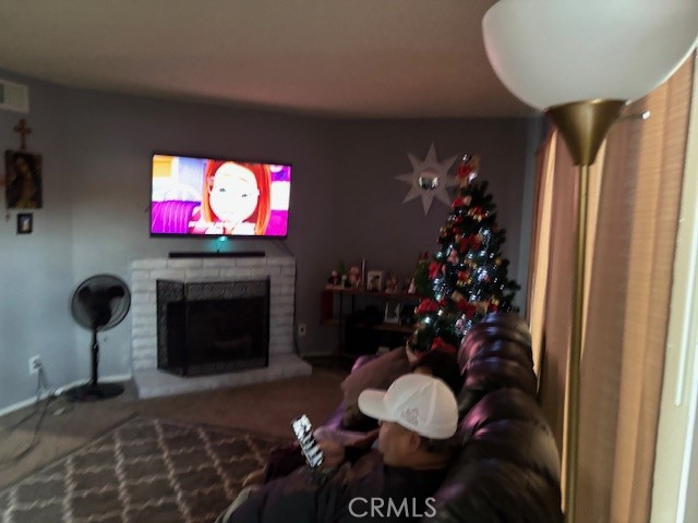 33371 Cheltam Way, Unit 3 Dana Point, CA 92629 - Photo 3 of 24 a living room with furniture and a fireplace