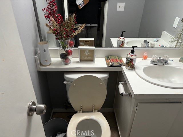 33371 Cheltam Way, Unit 3 Dana Point, CA 92629 - Photo 5 of 24 a bathroom with a toilet sink and mirror