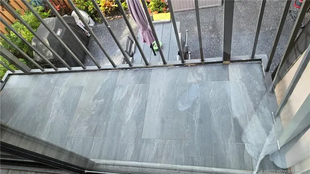 a view of outdoor space with wooden floor