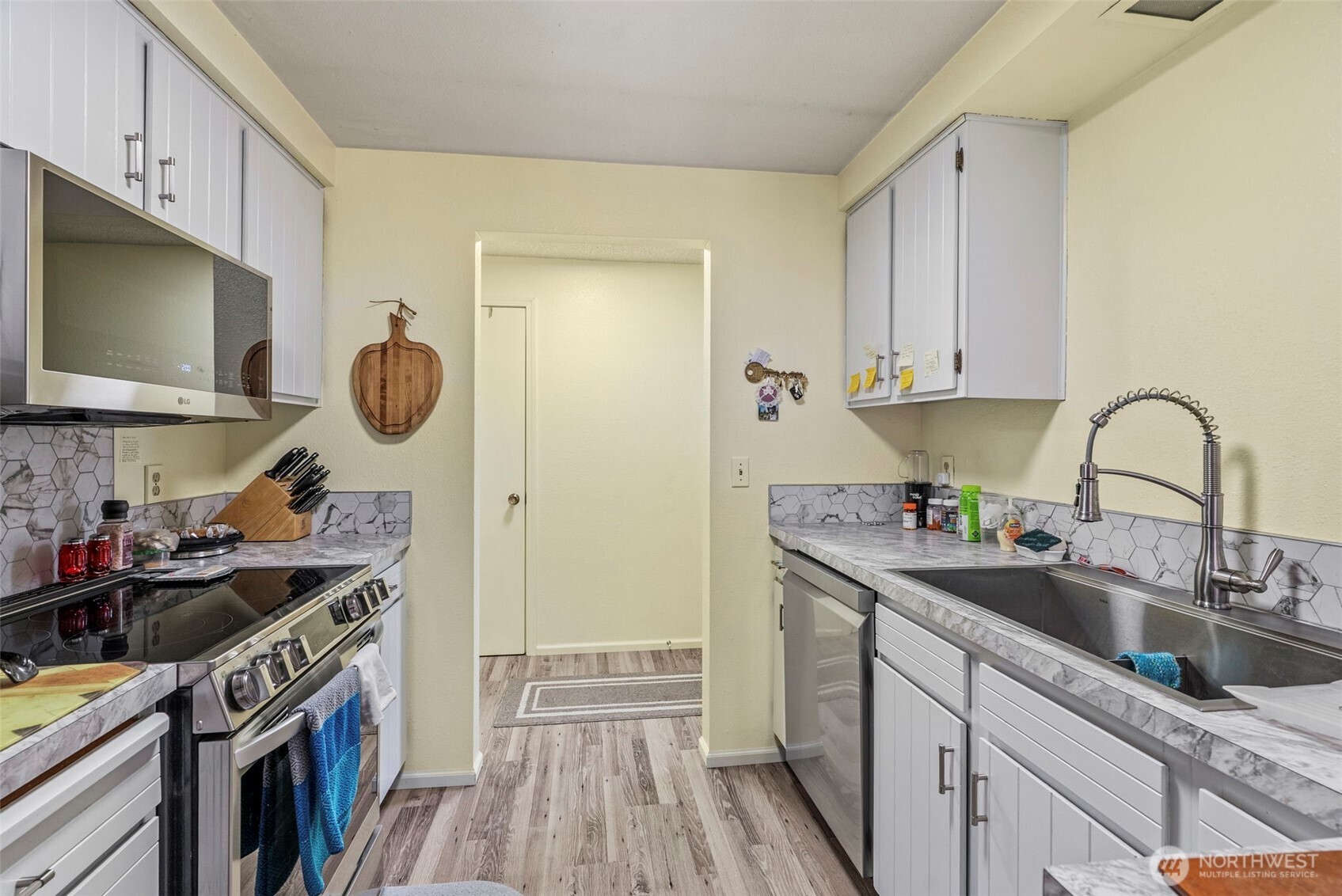 1 Teal Street Longview, WA 98632 - Photo 14 of 36 a kitchen with a sink and a stove top oven
