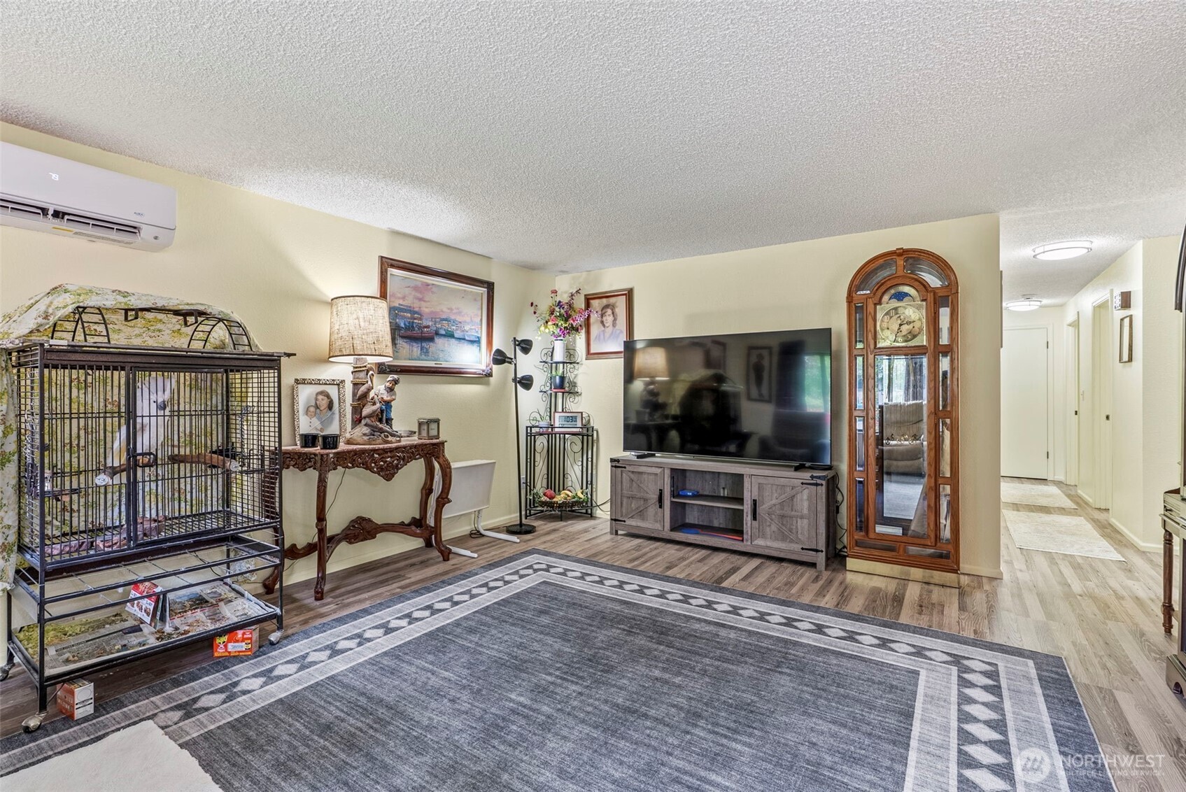 1 Teal Street Longview, WA 98632 - Photo 18 of 36 a living room with furniture a flat screen tv and wooden floor