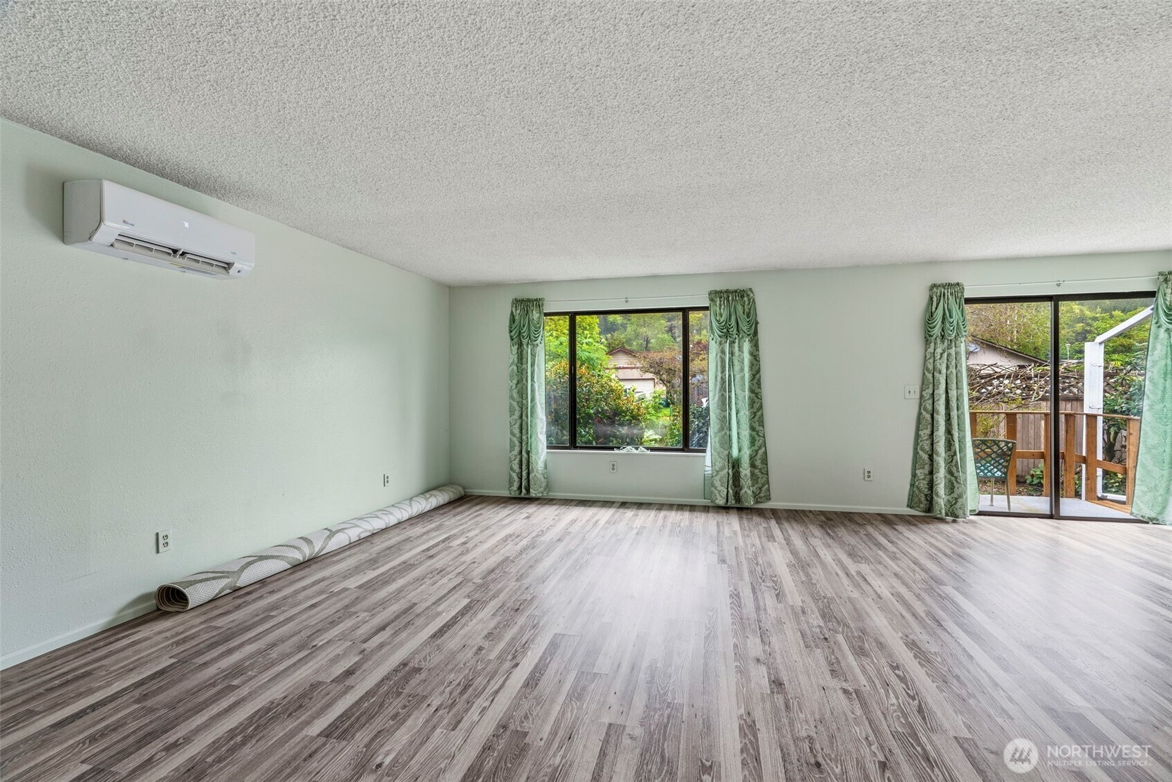 1 Teal Street Longview, WA 98632 - Photo 19 of 36 an empty room with wooden floor and windows
