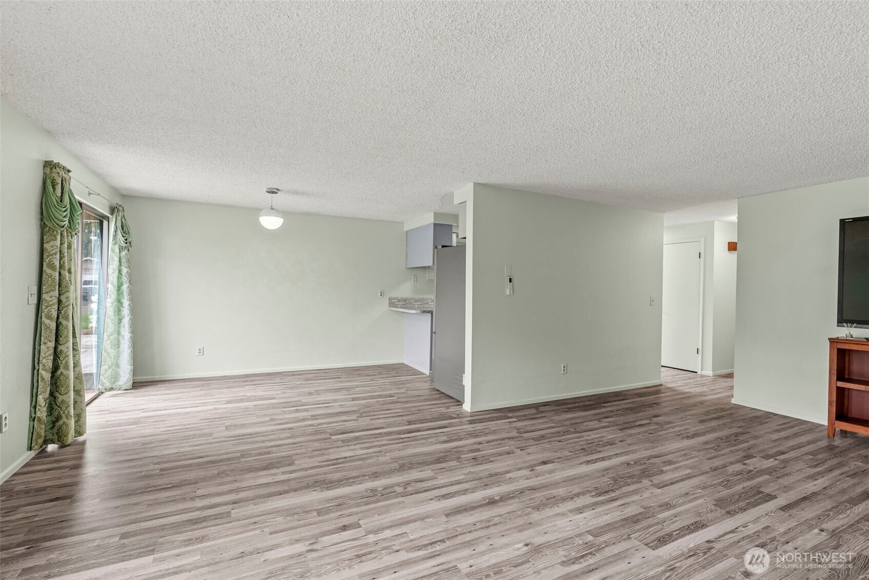 1 Teal Street Longview, WA 98632 - Photo 21 of 36 a view of an empty room with wooden floor and a window