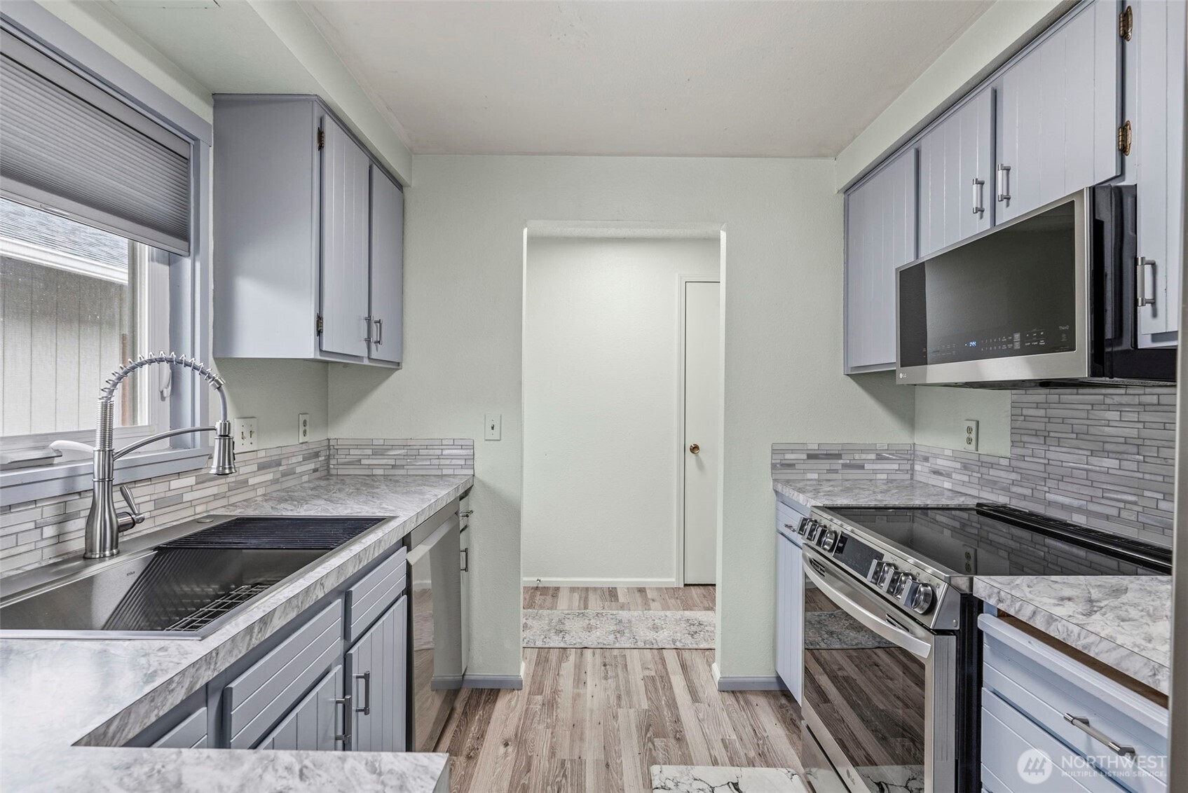 1 Teal Street Longview, WA 98632 - Photo 25 of 36 a kitchen with a sink stove and microwave