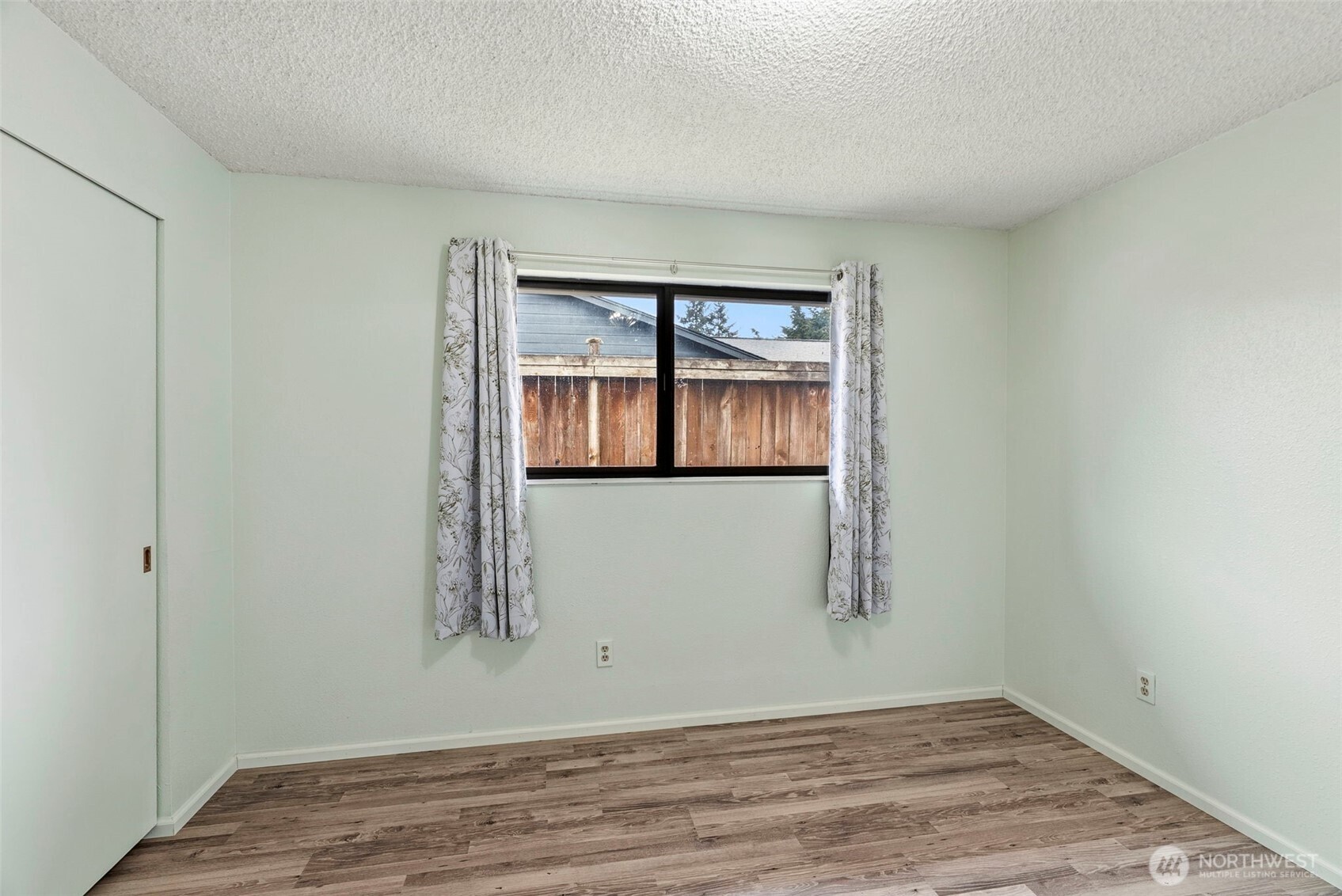 1 Teal Street Longview, WA 98632 - Photo 27 of 36 an empty room with wooden floor and windows
