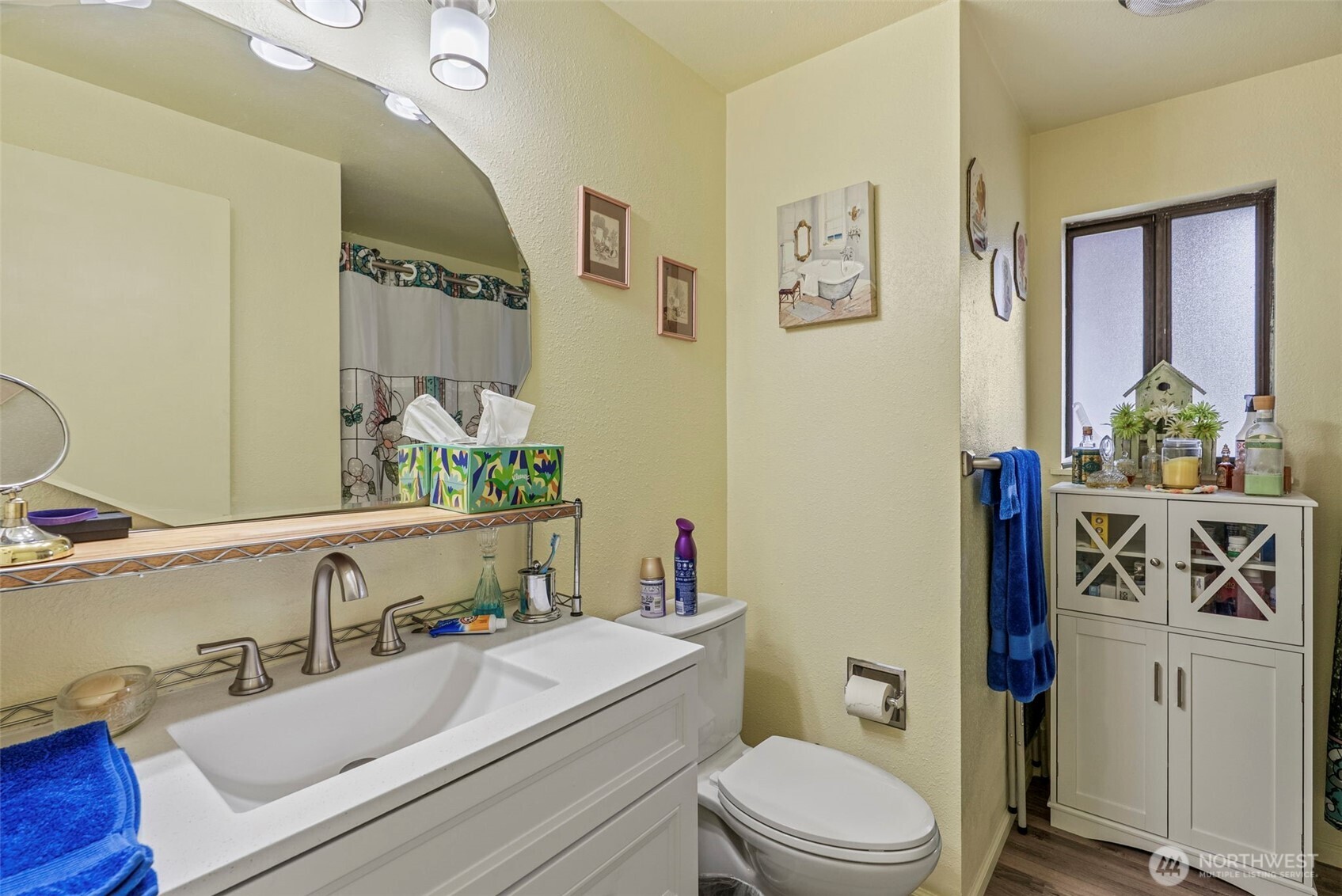 1 Teal Street Longview, WA 98632 - Photo 10 of 36 a bathroom with a sink a toilet and shower curtain