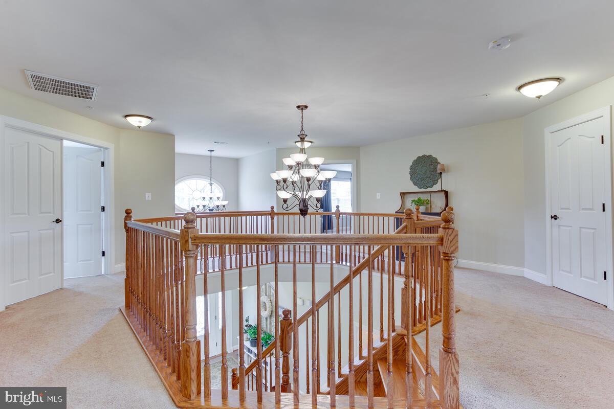 378 East Bay Front Road Deale, MD 20751 - Photo 22 of 43 a view of a dining room with furniture and chandelier