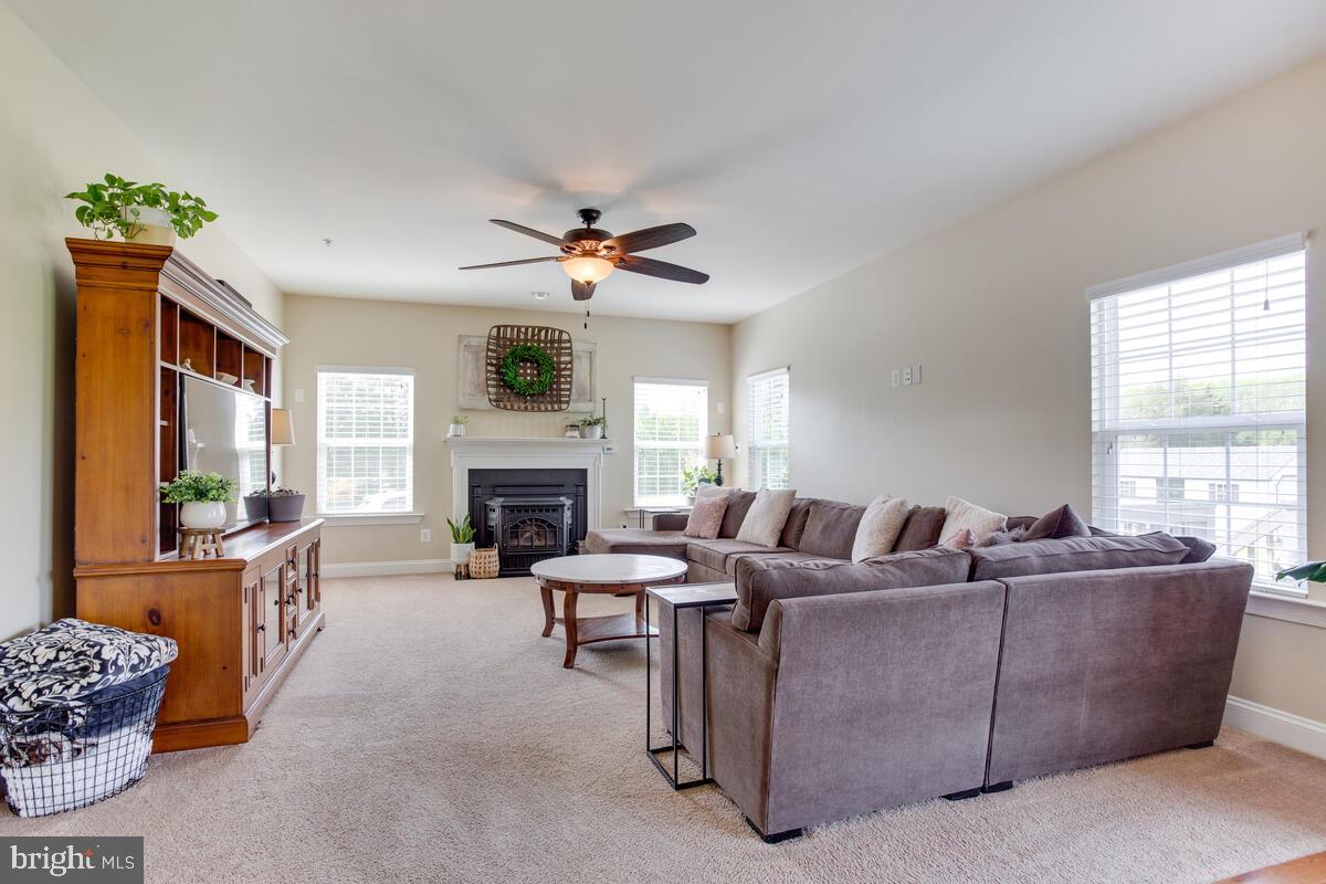 378 East Bay Front Road Deale, MD 20751 - Photo 8 of 43 a living room with furniture and a fireplace