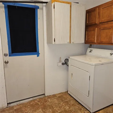 a view of storage and utility room with washer and dryer