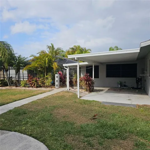 a view of house with outdoor space and porch