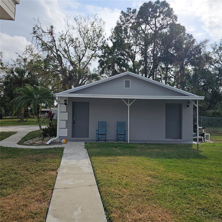 901 8th Street Southwest Ruskin, FL 33570 - Photo 24 of 27 a front view of a house with garden
