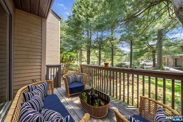 a view of balcony with couch and chairs