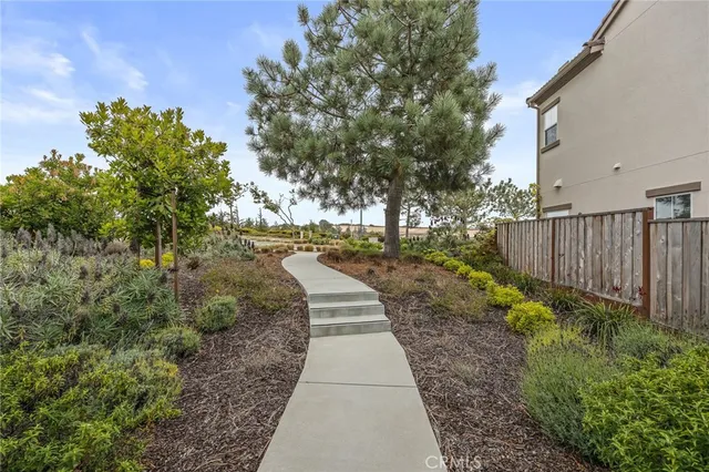 a view of a pathway with a yard