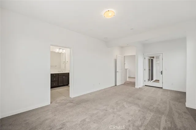 an empty room with a bathroom