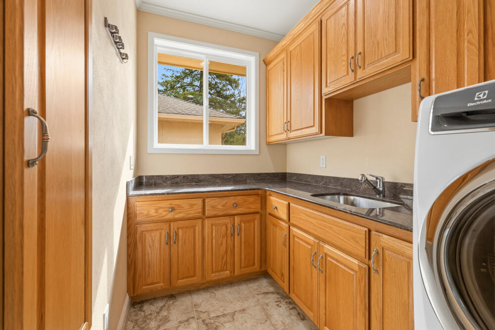 6586 Cooper's Hawk Road Klamath Falls, OR 97601 - Photo 31 of 68 a kitchen with stainless steel appliances granite countertop a sink and cabinets