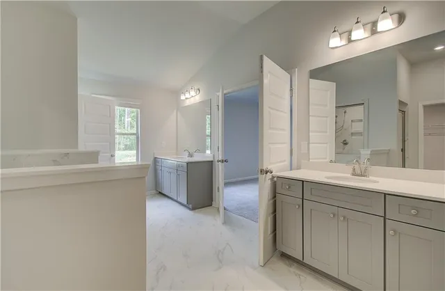 a bathroom with a glass shower door