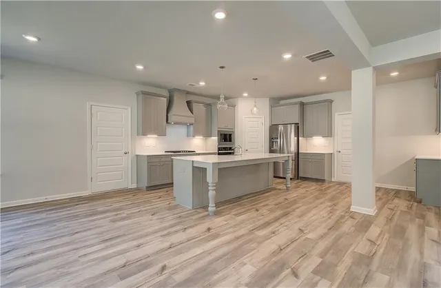 a view of kitchen with wooden floor