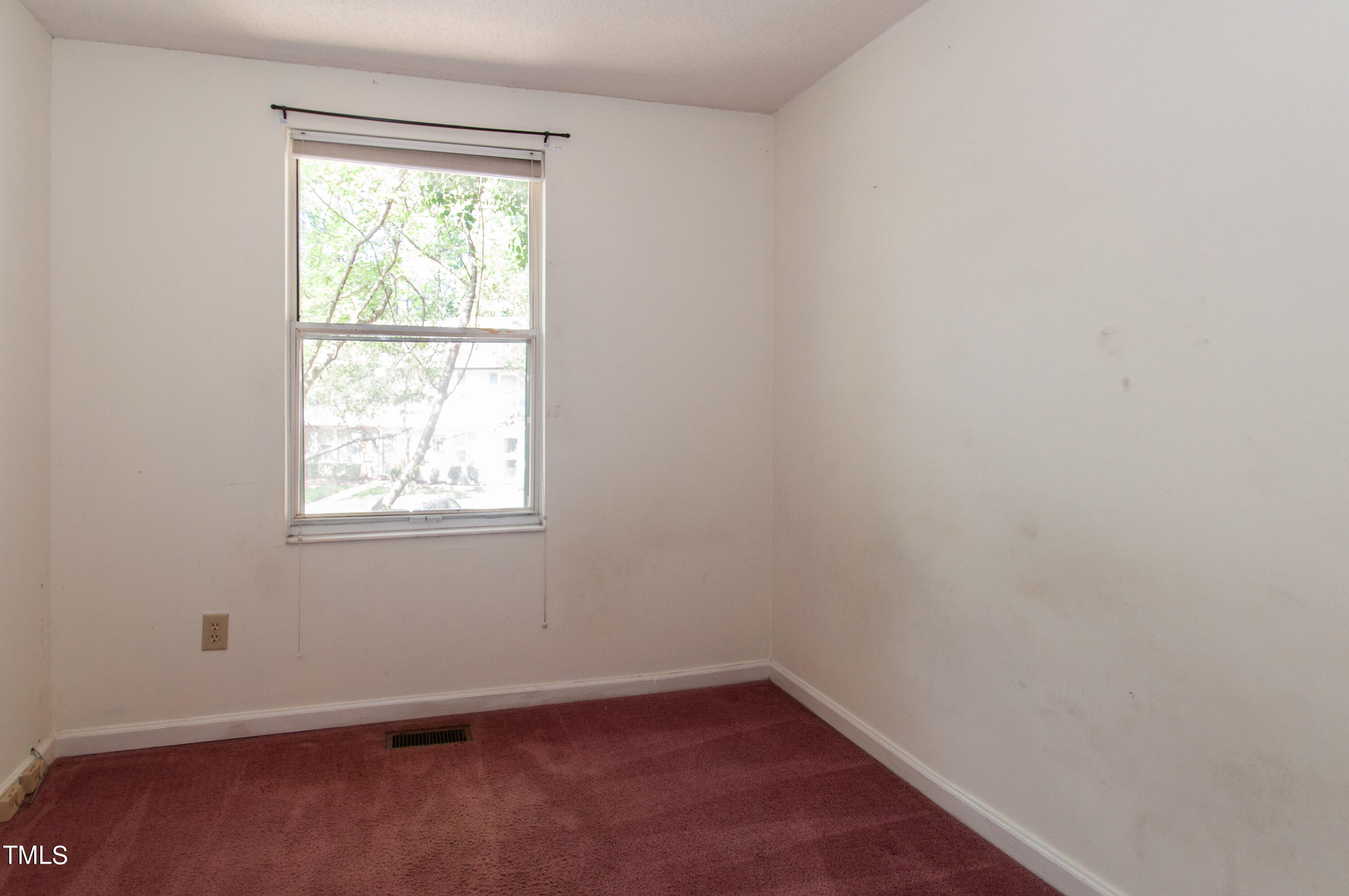 7804 Stephanie Lane Raleigh, NC 27615 - Photo 19 of 37 an empty room with a window