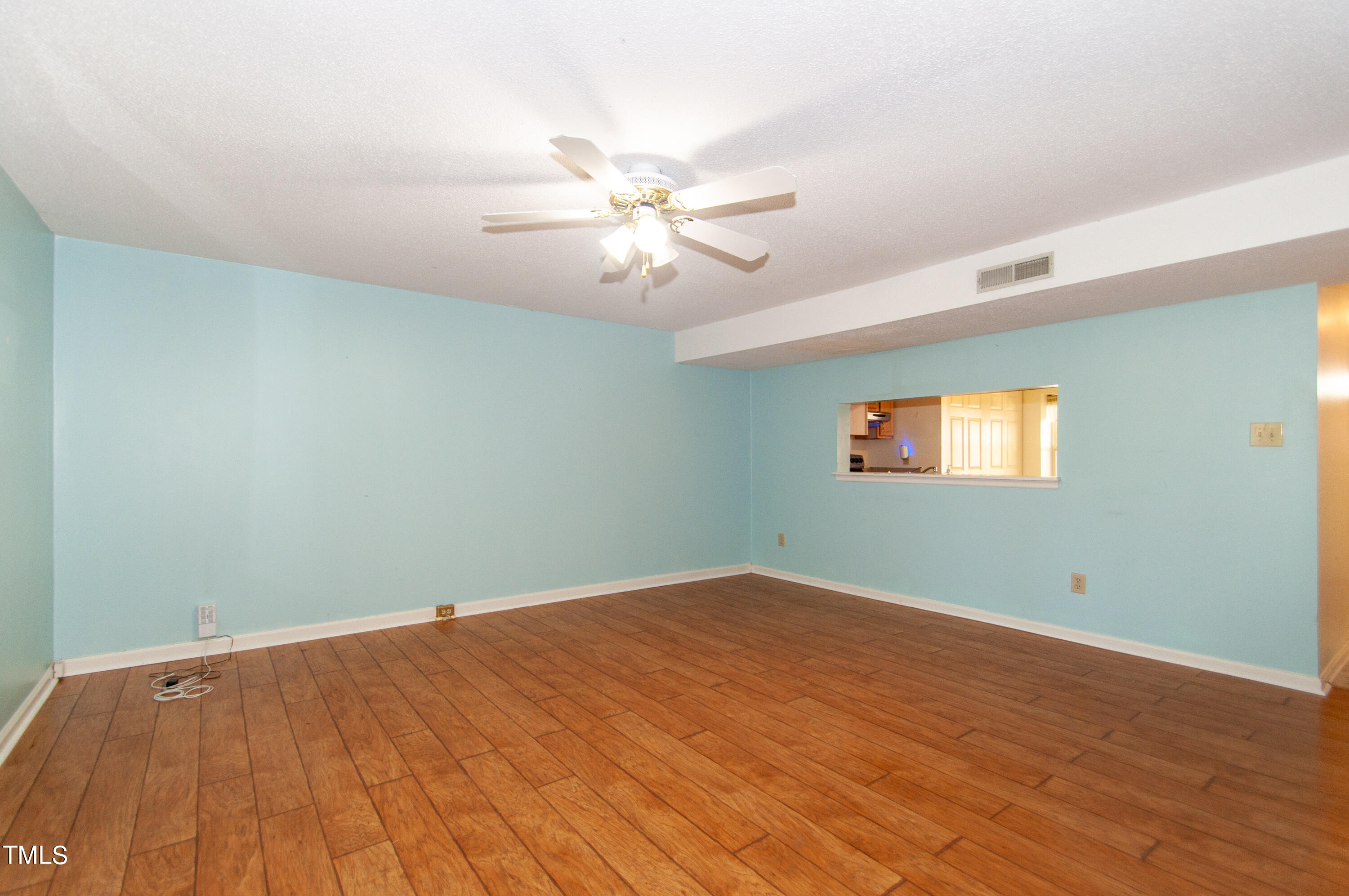 7804 Stephanie Lane Raleigh, NC 27615 - Photo 7 of 37 an empty room with windows and fan