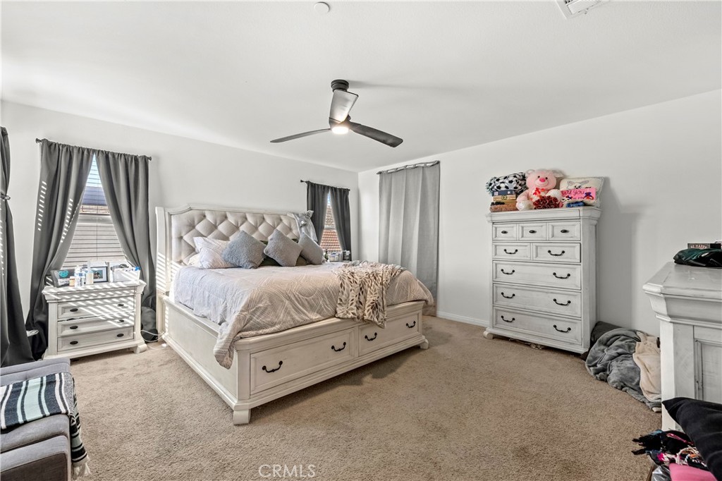 774 Green Court Perris, CA 92571 - Photo 12 of 25 a bedroom with a bed and a tv