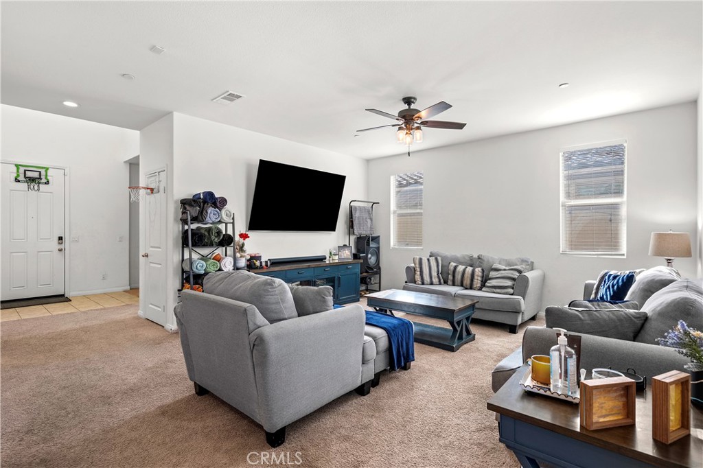 774 Green Court Perris, CA 92571 - Photo 3 of 25 a living room with furniture and a flat screen tv