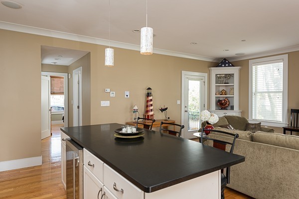 1506 Columbia Road, Unit 1 Boston, MA 02127 - Photo 14 of 24 a view of kitchen island with stainless steel appliances