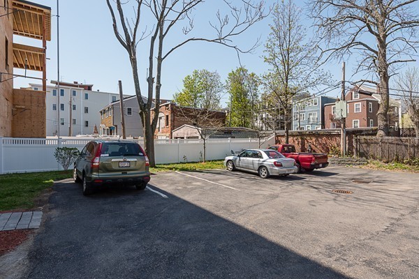 1506 Columbia Road, Unit 1 Boston, MA 02127 - Photo 21 of 24 a view of street with parked cars