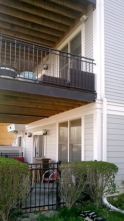 1506 Columbia Road, Unit 1 Boston, MA 02127 - Photo 4 of 24 a view of backyard with barbeque grill and outdoor seating