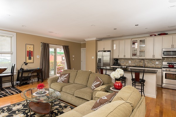 1506 Columbia Road, Unit 1 Boston, MA 02127 - Photo 10 of 24 a living room with furniture and kitchen view