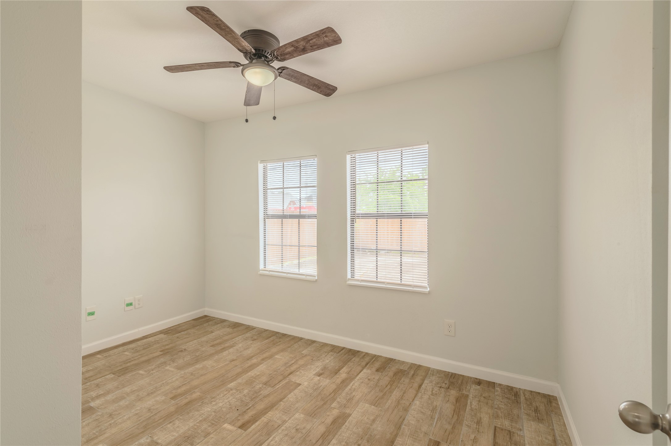 2319 Rosewood Street, Unit A Houston, TX 77004 - Photo 11 of 15 an empty room with a window and a ceiling fan