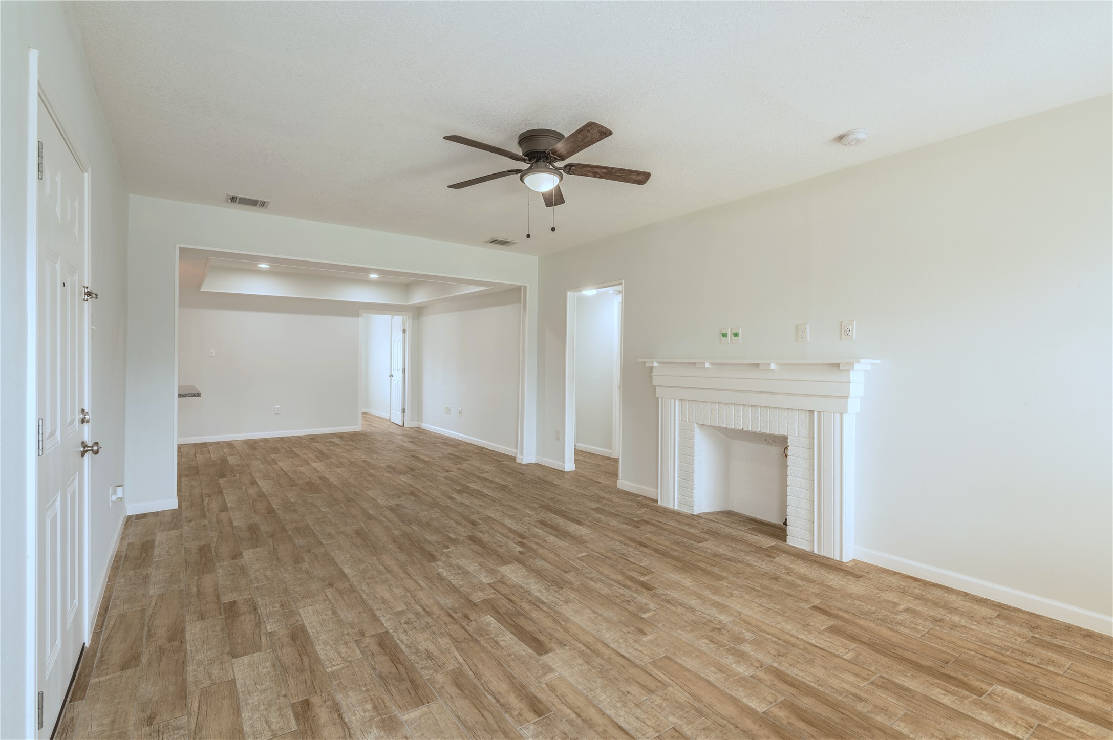 2319 Rosewood Street, Unit A Houston, TX 77004 - Photo 4 of 15 a view of empty room with cabinet and ceiling fan