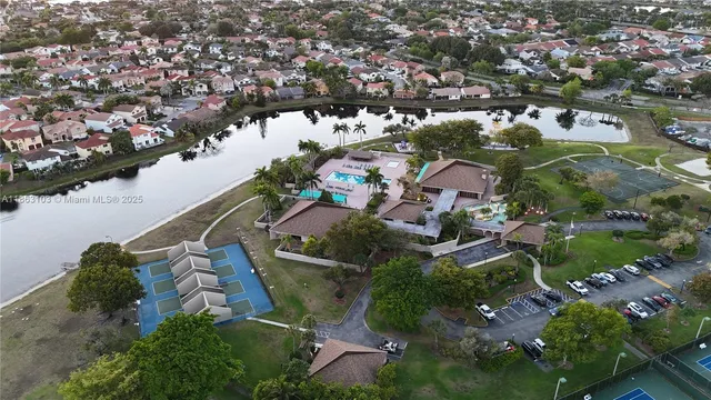 an aerial view of house with yard swimming pool and outdoor seating