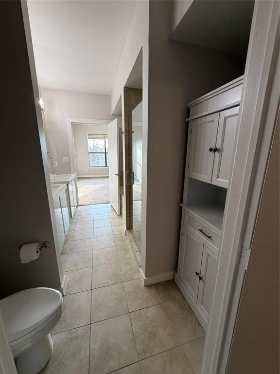 4040 North Hall Street, Unit 309 Dallas, TX 75219 - Photo 9 of 18 a bathroom with a toilet and a sink