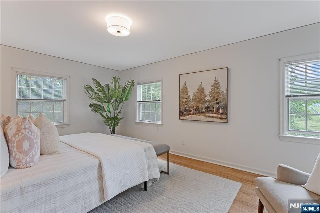 687 Grove Street Montclair, NJ 07043 - Photo 10 of 18 a bedroom with a large bed and a window